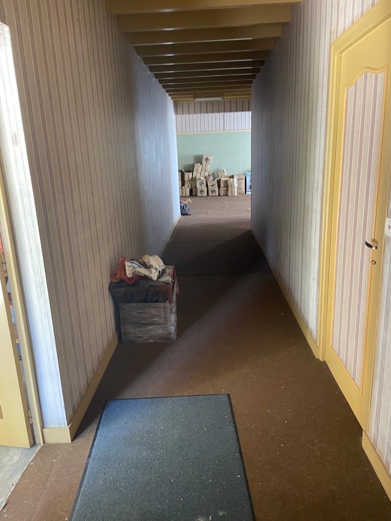 Hallway connecting the rooms inside the outbuilding